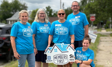 Members First Credit Union team volunteering in Saginaw Community.